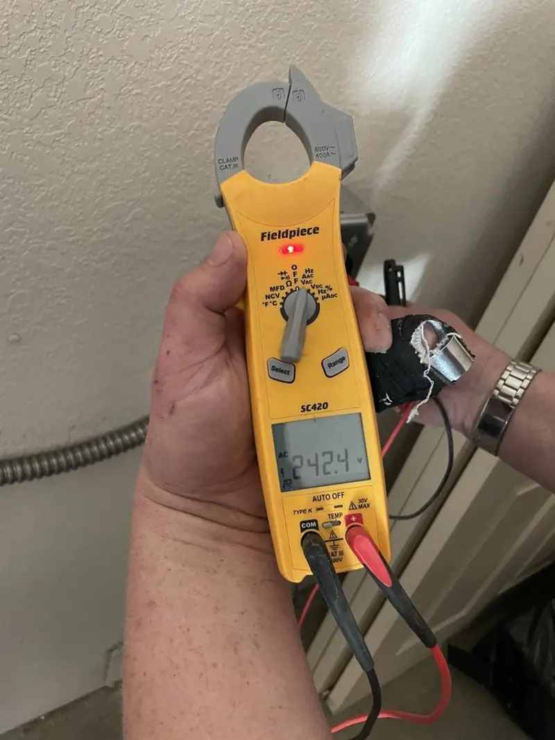 Voltage testing with clamp meter during Whole House Surge Protector in Fairhaven
